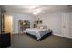 Comfortable bedroom with large bed, shelving and wall art, offering a relaxing retreat at 200 Sugar Mill Ln, Canton, GA 30115