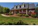 Beautifully landscaped front yard featuring brick walkway and green lawn at 200 Sugar Mill Ln, Canton, GA 30115