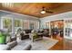 Sunroom-like living space with vaulted wood ceiling, plenty of windows, and views of the outdoors at 200 Sugar Mill Ln, Canton, GA 30115