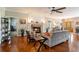 Living room with hardwood floors, a fireplace, neutral furniture, and a large front door at 200 Sugar Mill Ln, Canton, GA 30115
