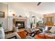 A living room with hardwood floors, a fireplace, neutral furniture, and a large front door at 200 Sugar Mill Ln, Canton, GA 30115