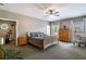 Spacious main bedroom offers natural light, two windows, and a view to an exercise area at 200 Sugar Mill Ln, Canton, GA 30115