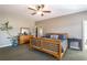 Large main bedroom with ceiling fan, ample space, and lots of natural light through the window at 200 Sugar Mill Ln, Canton, GA 30115
