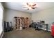 Home office area features a ceiling fan, window and a storage unit for records and music equipment at 200 Sugar Mill Ln, Canton, GA 30115