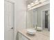 Bathroom featuring granite counters, a vessel sink, and a large mirror at 1105 Westbrooke Ne Way, Brookhaven, GA 30319