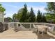 Outdoor deck area with seating, railing, and trees in the backyard at 1105 Westbrooke Ne Way, Brookhaven, GA 30319