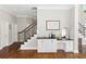 Welcoming entryway with hardwood floors, staircase, and built-in cabinets for storage at 1105 Westbrooke Ne Way, Brookhaven, GA 30319
