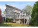 Exterior shot of back of house with deck, stairs, and backyard at 1105 Westbrooke Ne Way, Brookhaven, GA 30319