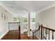 Second story landing with wood floors and views of the living room at 1105 Westbrooke Ne Way, Brookhaven, GA 30319