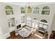 Living room boasts two-story windows, fireplace, and built-in shelving at 1105 Westbrooke Ne Way, Brookhaven, GA 30319