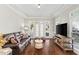 Bright living room with hardwood floors and a view to the french doors at 1105 Westbrooke Ne Way, Brookhaven, GA 30319