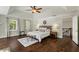 This primary bedroom is large, light, and bright with tray ceilings and hardwood floors at 1105 Westbrooke Ne Way, Brookhaven, GA 30319