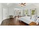 Spacious primary bedroom boasts a tray ceiling, bay window, and hardwood floors at 1105 Westbrooke Ne Way, Brookhaven, GA 30319