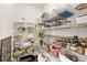 Walk-in pantry featuring metal rack shelving for ample storage at 1105 Westbrooke Ne Way, Brookhaven, GA 30319