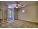 An unfurnished bedroom featuring a double window and closet with mirrored doors at 1660 Weems Rd, Locust Grove, GA 30248