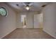 An empty bedroom that connects to a bathroom and has a window at 1660 Weems Rd, Locust Grove, GA 30248