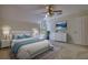 Comfortable bedroom featuring a ceiling fan, large bed, and natural light from the window at 1660 Weems Rd, Locust Grove, GA 30248