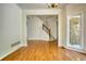 Spacious dining room featuring hardwood floors, crown molding and staircase to the second floor at 1660 Weems Rd, Locust Grove, GA 30248