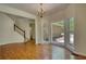 Dining room complete with wood floors, chandelier and staircase to the second floor at 1660 Weems Rd, Locust Grove, GA 30248