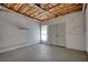 Spacious garage area with shelving and ample room for storage or workshop at 1660 Weems Rd, Locust Grove, GA 30248