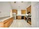 Spacious kitchen featuring stainless steel appliances, wood cabinets and tile floor at 1660 Weems Rd, Locust Grove, GA 30248