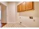 Functional laundry room with upper cabinets and tile flooring at 1660 Weems Rd, Locust Grove, GA 30248