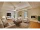 Cozy living room features furniture and a wall mounted TV, with hardwood floors at 1660 Weems Rd, Locust Grove, GA 30248