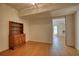 Inviting living area featuring wood floors, vintage cabinet, and an open layout at 1660 Weems Rd, Locust Grove, GA 30248