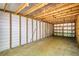 The shed's interior has ample room, a concrete floor and pegboard for storing equipment and tools at 1660 Weems Rd, Locust Grove, GA 30248