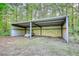 Large vehicle storage area with ample space to store vehicles and outdoor equipment at 1660 Weems Rd, Locust Grove, GA 30248