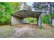 Vehicle storage area with metal roof, providing ample room to protect vehicles from the elements at 1660 Weems Rd, Locust Grove, GA 30248