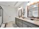 Elegant bathroom with double vanity, granite countertops, framed mirrors, and modern lighting fixtures at 220 Alcovy Reserve Way, Covington, GA 30014