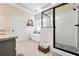 Bright bathroom featuring granite countertops, a standalone tub, and a modern glass-enclosed shower at 220 Alcovy Reserve Way, Covington, GA 30014