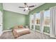 Comfortable bedroom with a vaulted ceiling, fan, and natural light from the window at 220 Alcovy Reserve Way, Covington, GA 30014