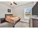 Comfortable bedroom with a bed, side table and natural light from the window at 220 Alcovy Reserve Way, Covington, GA 30014