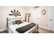 Bright bedroom featuring a comfortable bed, windmill decor, and a full-length mirror at 220 Alcovy Reserve Way, Covington, GA 30014