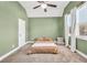 Comfortable bedroom with a vaulted ceiling, fan, and natural light from the window at 220 Alcovy Reserve Way, Covington, GA 30014