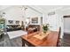 Open-concept dining area featuring a large wooden table and views into the adjacent living space at 220 Alcovy Reserve Way, Covington, GA 30014