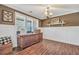 Bright dining room boasts wainscoting, ample natural light, and modern flooring for inviting gatherings at 220 Alcovy Reserve Way, Covington, GA 30014