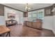 Open-concept dining area offers abundant natural light, wainscoting, and access to multiple rooms at 220 Alcovy Reserve Way, Covington, GA 30014