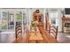 Dining table with chairs and flowers, with views to an outdoor patio area at 220 Alcovy Reserve Way, Covington, GA 30014