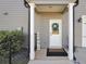 Welcoming entrance with white door, decorative wreath, and cozy welcome mat, creating a warm first impression at 220 Alcovy Reserve Way, Covington, GA 30014