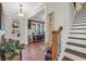 Welcoming entryway featuring stylish decor, a staircase, and a view into the living spaces at 220 Alcovy Reserve Way, Covington, GA 30014