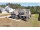 Charming two-story home with a covered porch and meticulously landscaped yard, perfect for outdoor living at 220 Alcovy Reserve Way, Covington, GA 30014