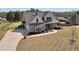 Charming two-story home with an attached garage and a classic covered front porch, showcasing curb appeal at 220 Alcovy Reserve Way, Covington, GA 30014