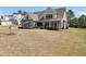 Charming two-story home with a covered porch, landscaped yard, and classic architectural details at 220 Alcovy Reserve Way, Covington, GA 30014