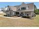 Charming two-story home with a welcoming front porch, landscaped yard, and traditional architectural style at 220 Alcovy Reserve Way, Covington, GA 30014