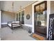 Inviting front porch with a charming swing, decorative door wreath, and a 