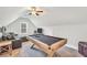 Spacious game room featuring a pool table and comfortable seating area at 220 Alcovy Reserve Way, Covington, GA 30014