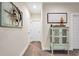 Charming hallway with decorative cabinet and artwork at 220 Alcovy Reserve Way, Covington, GA 30014